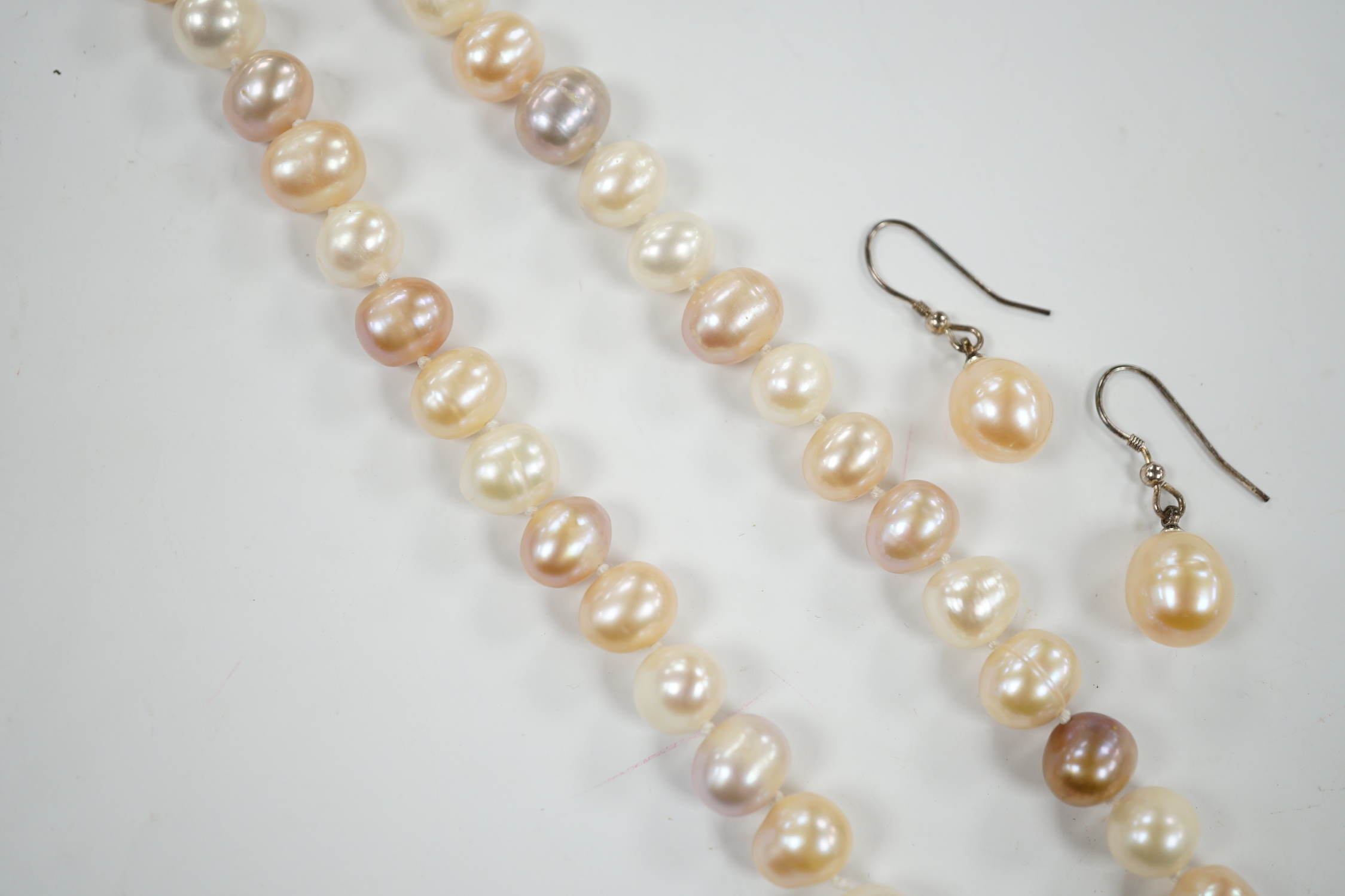 A single strand multi coloured freshwater pearl necklace, 44cm and a pair of freshwater pearl drop earrings.